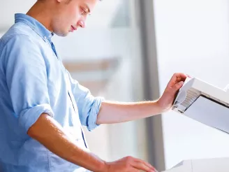 Man using photocopier lease